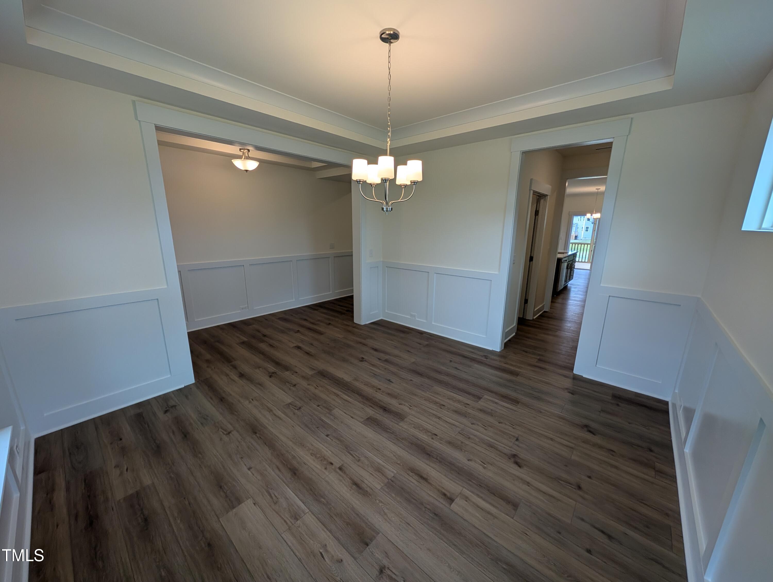 266 Weddington Way Benson, NC 27504 - Photo 5 of 35 wooden floor in an empty room with a window
