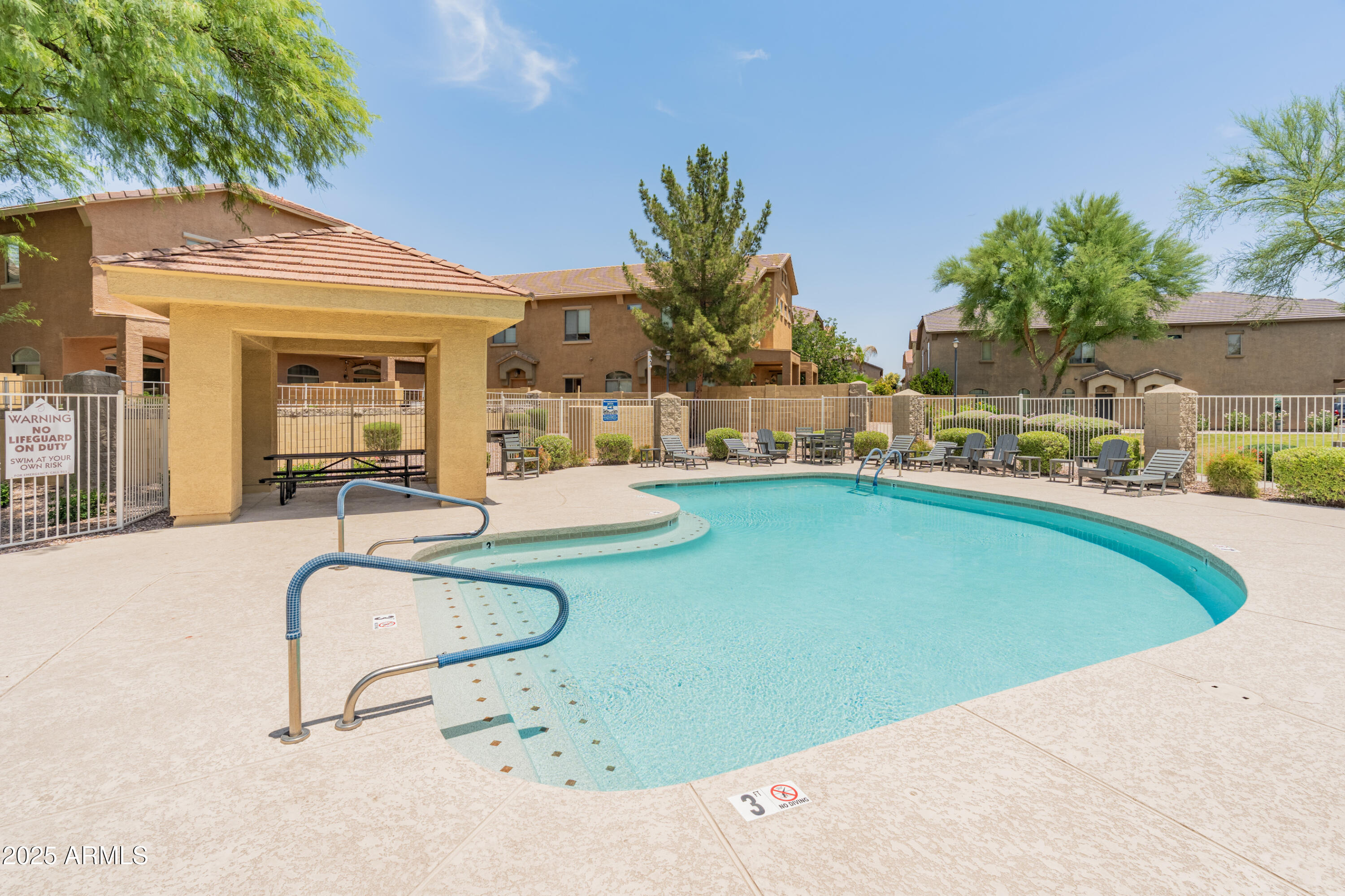 2150 East Bell Road, Unit 1088 Phoenix, AZ 85022 - Photo 23 of 25 a swimming pool with outdoor seating and yard