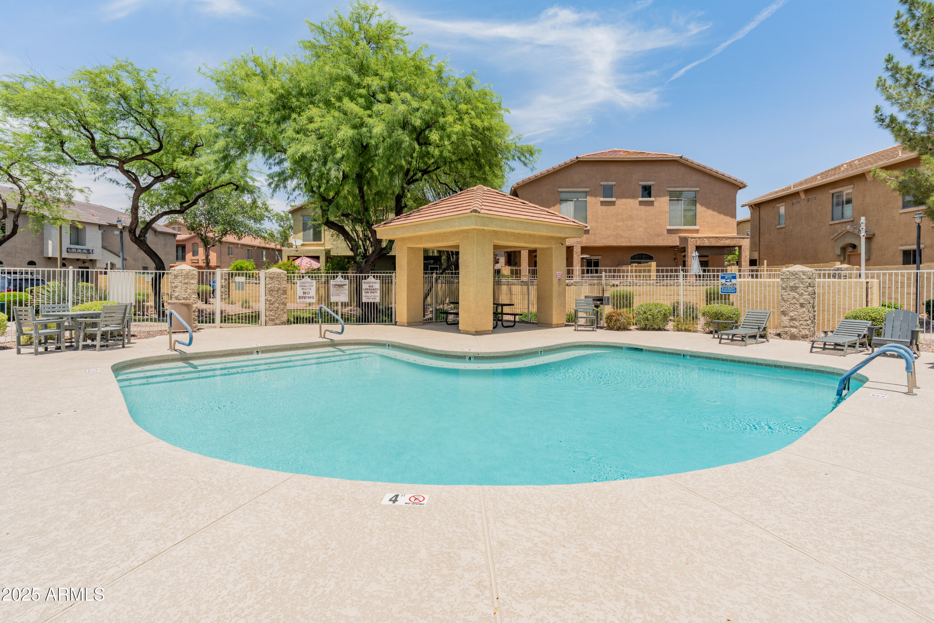 2150 East Bell Road, Unit 1088 Phoenix, AZ 85022 - Photo 3 of 25 a view of a house with a swimming pool