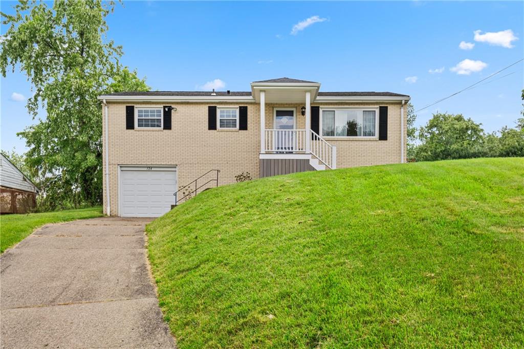 124 Clover Drive Monaca, PA 15061 - Photo 1 of 27 a house view with a garden space