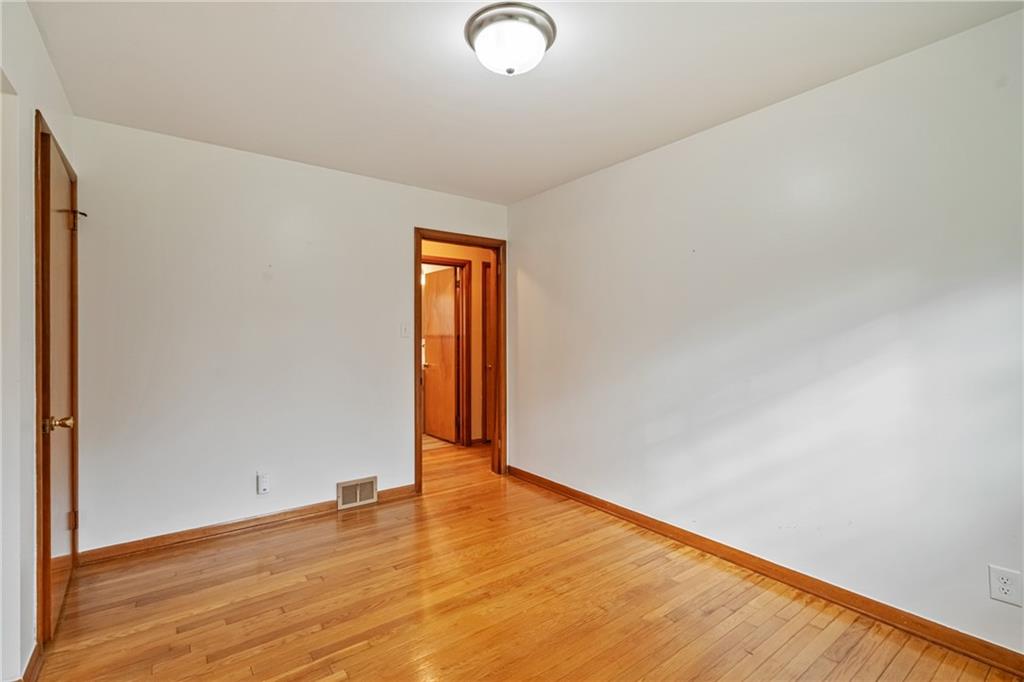 124 Clover Drive Monaca, PA 15061 - Photo 11 of 27 a view of an empty room and wooden floor