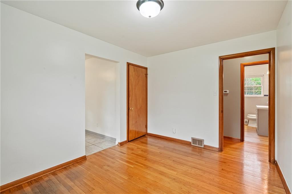 124 Clover Drive Monaca, PA 15061 - Photo 12 of 27 a view of an empty room with wooden floor