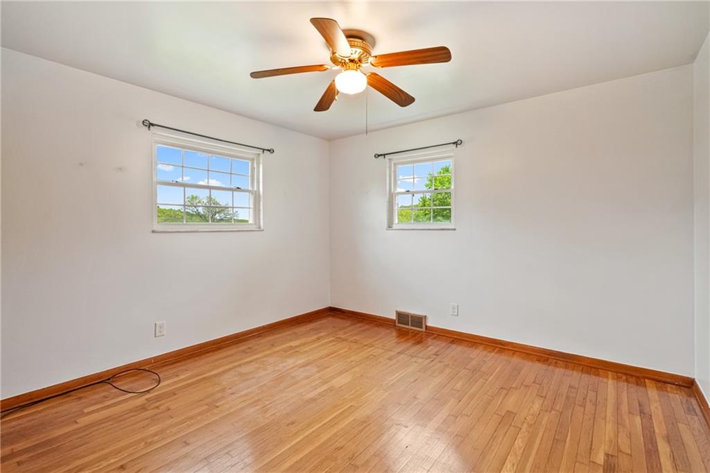 124 Clover Drive Monaca, PA 15061 - Photo 14 of 27 wooden floor in an empty room with a window