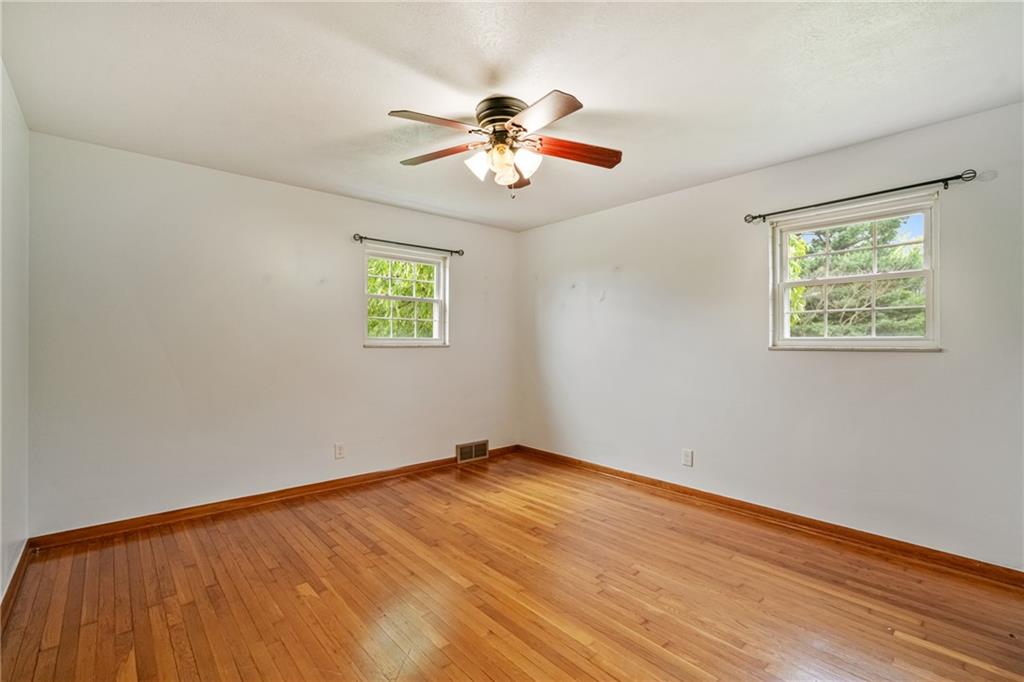 124 Clover Drive Monaca, PA 15061 - Photo 17 of 27 a view of empty room with wooden floor