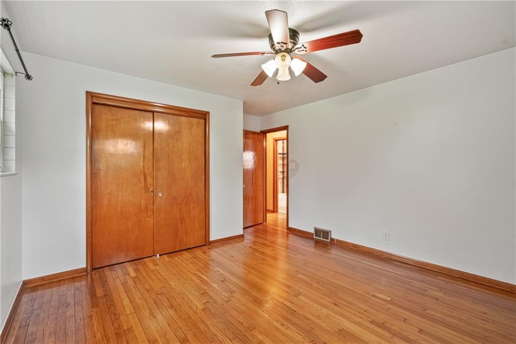 124 Clover Drive Monaca, PA 15061 - Photo 18 of 27 a view of an empty room with wooden floor
