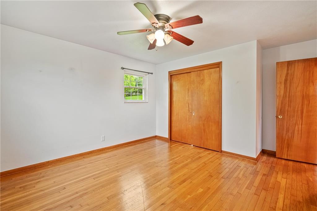 124 Clover Drive Monaca, PA 15061 - Photo 19 of 27 wooden floor in an empty room with a window