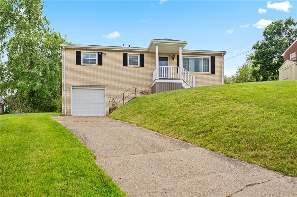 124 Clover Drive Monaca, PA 15061 - Photo 2 of 27 a front view of house with yard