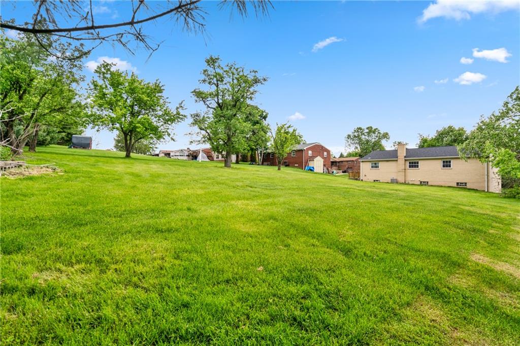 124 Clover Drive Monaca, PA 15061 - Photo 26 of 27 a view of a backyard with a garden