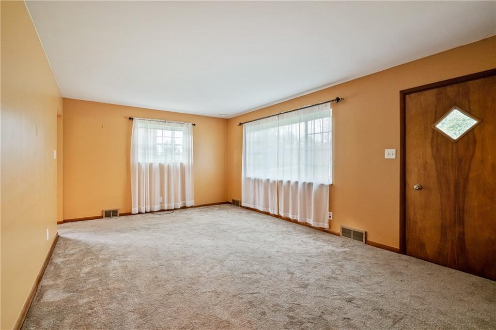 124 Clover Drive Monaca, PA 15061 - Photo 5 of 27 an empty room with windows and closet