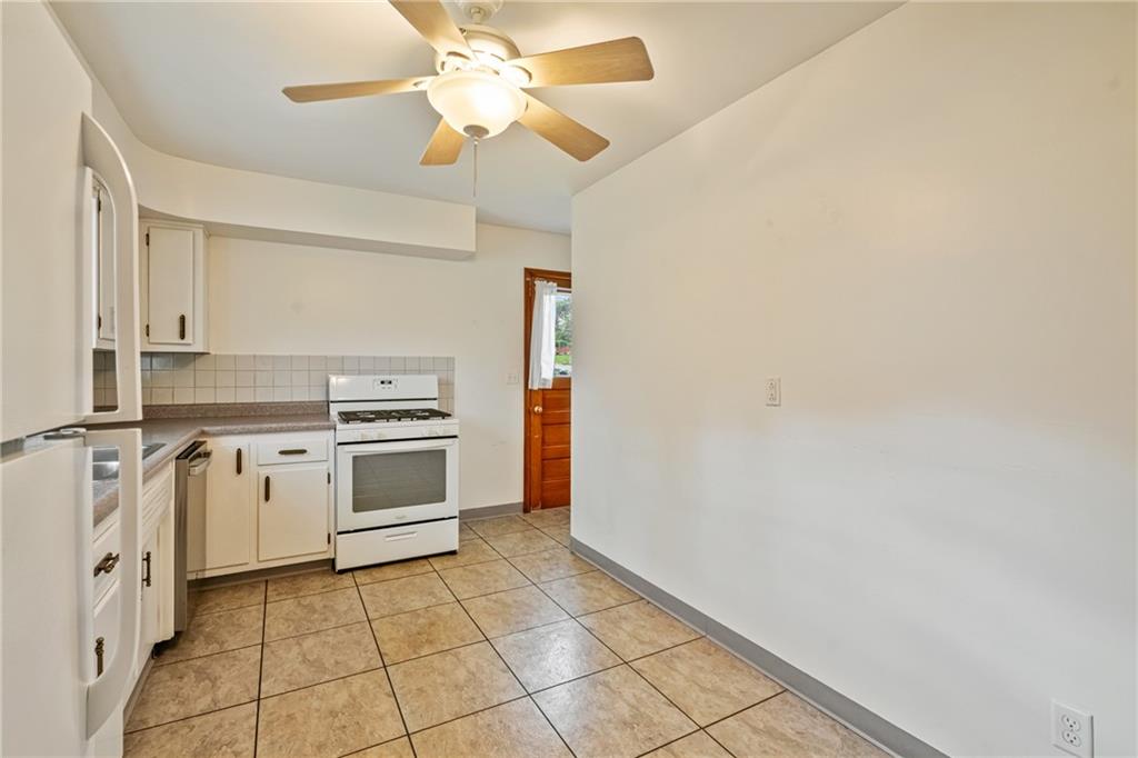 124 Clover Drive Monaca, PA 15061 - Photo 8 of 27 a kitchen with a stove cabinets and counter space