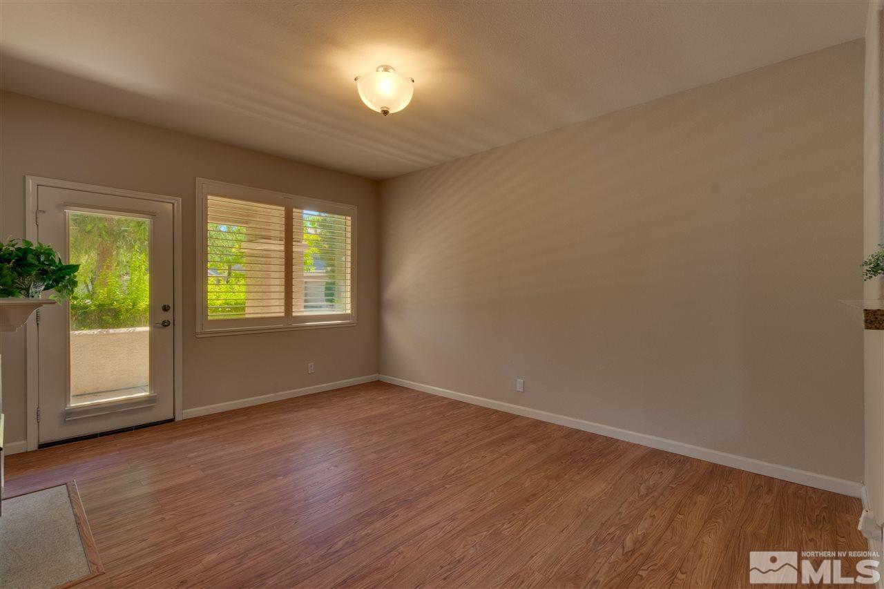 900 South, Unit 3113 Reno, NV 89521 - Photo 3 of 15 a view of an empty room with a window and wooden floor