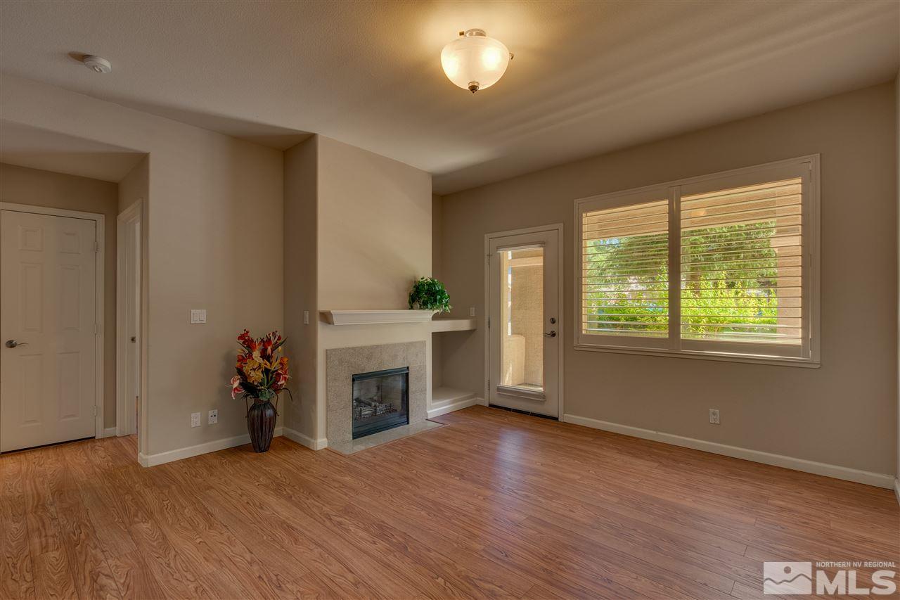900 South, Unit 3113 Reno, NV 89521 - Photo 4 of 15 a view of an empty room with a window and fireplace