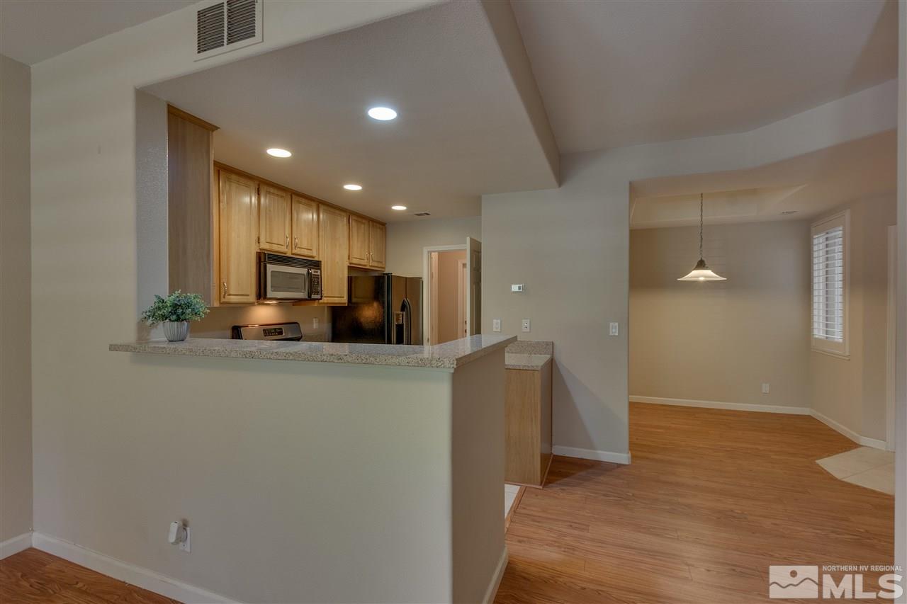 900 South, Unit 3113 Reno, NV 89521 - Photo 6 of 15 a view of kitchen with furniture and wooden floor