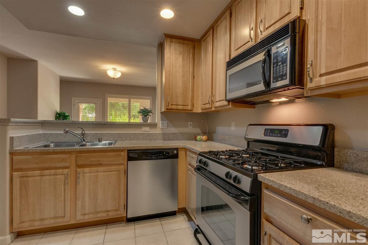900 South, Unit 3113 Reno, NV 89521 - Photo 7 of 15 a kitchen with cabinets appliances and a counter space