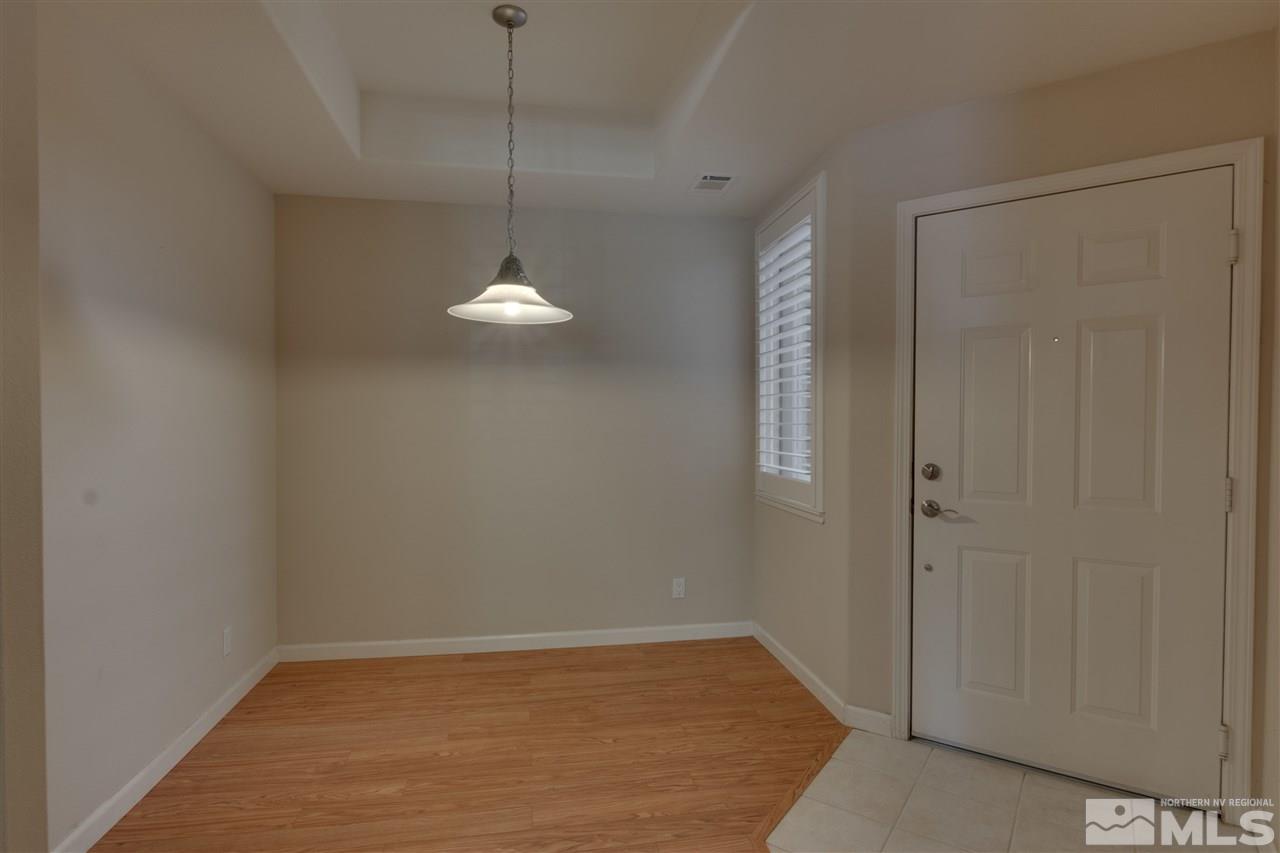 900 South, Unit 3113 Reno, NV 89521 - Photo 8 of 15 a view of a chandelier fan and hardwood floor