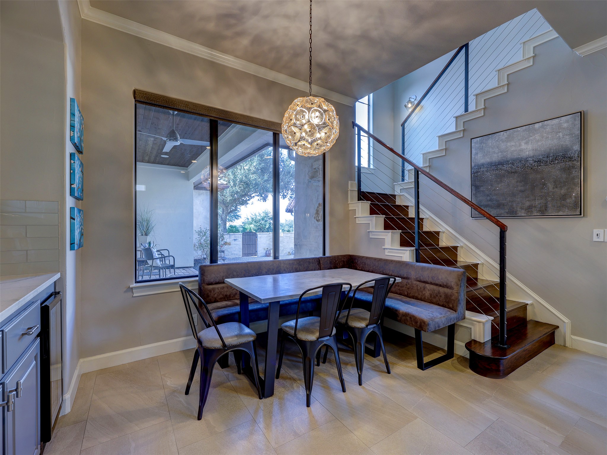 11805 Pleasant Panorama View Austin, TX 78738 - Photo 13 of 40 Enjoy this dining nook with banquette seating that creates a cozy yet elevated setting for casual morning coffee or evening dinners.