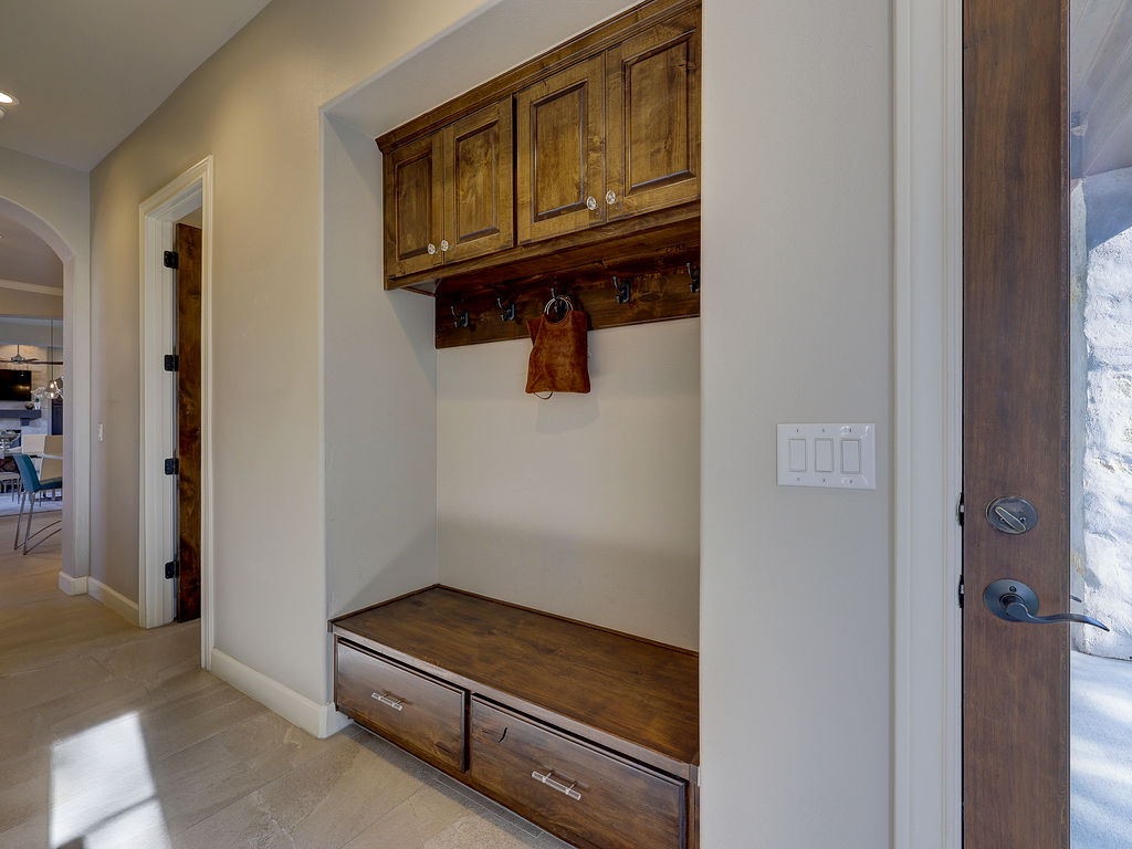 11805 Pleasant Panorama View Austin, TX 78738 - Photo 18 of 40 As you enter from the garage, the additional storage offers a
place to tuck away all of your items.