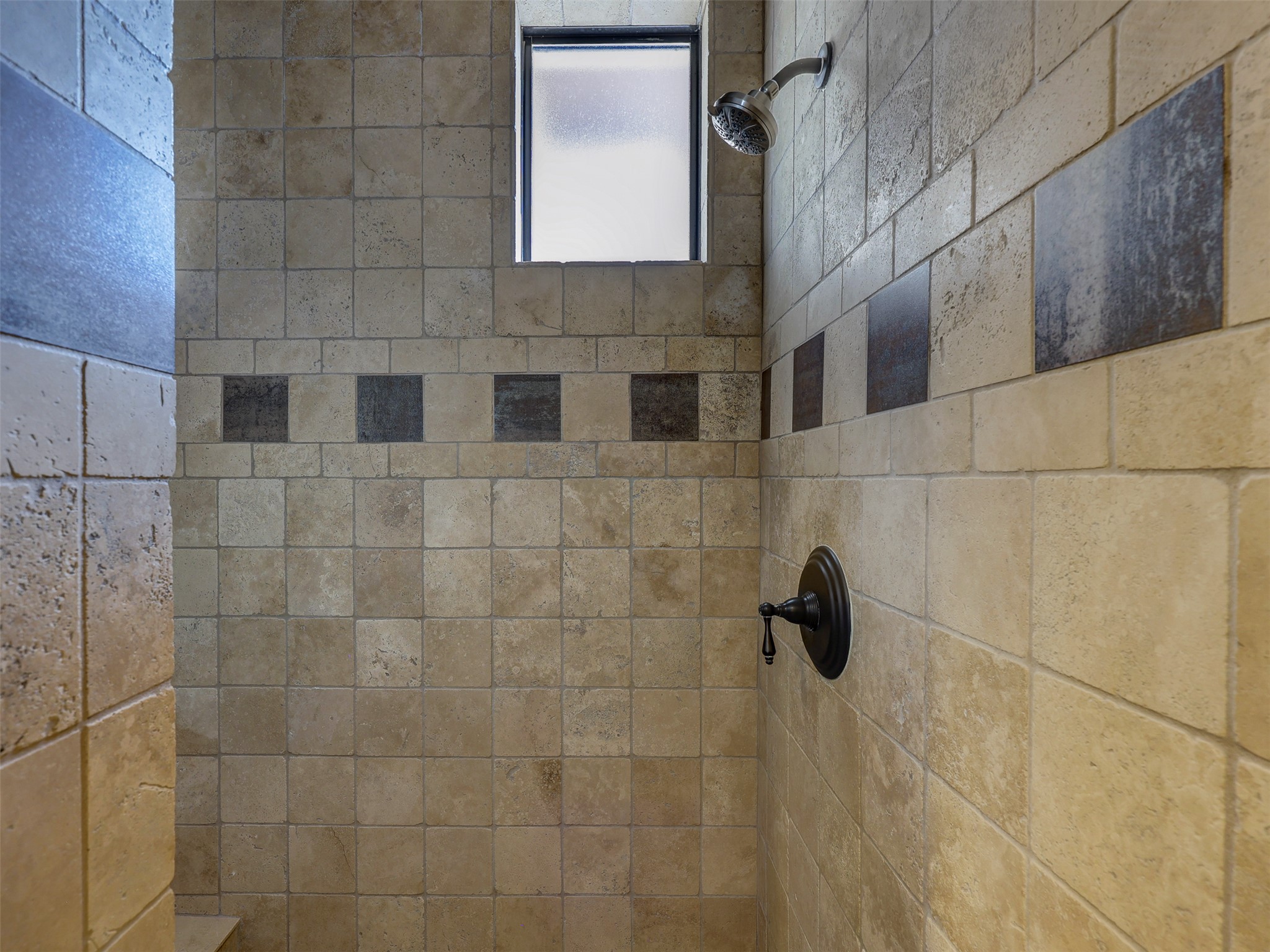 11805 Pleasant Panorama View Austin, TX 78738 - Photo 23 of 40 The primary bath continues its commitment to premium materials with a massive walk-in shower clad in travertine tile.