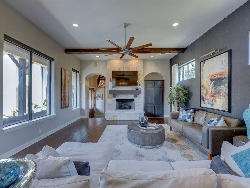 11805 Pleasant Panorama View Austin, TX 78738 - Photo 10 of 40 The comfortable living area is anchored by a floor to ceiling stone fireplace for those cold Texas nights.