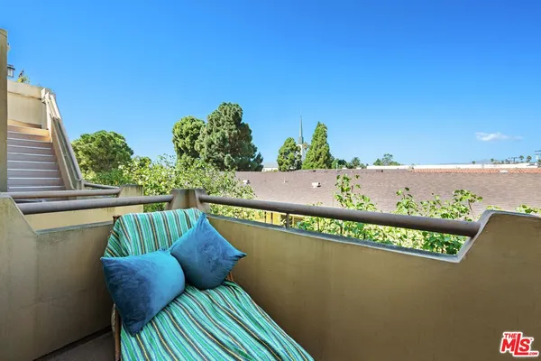 a view of a chairs and table on the terrace