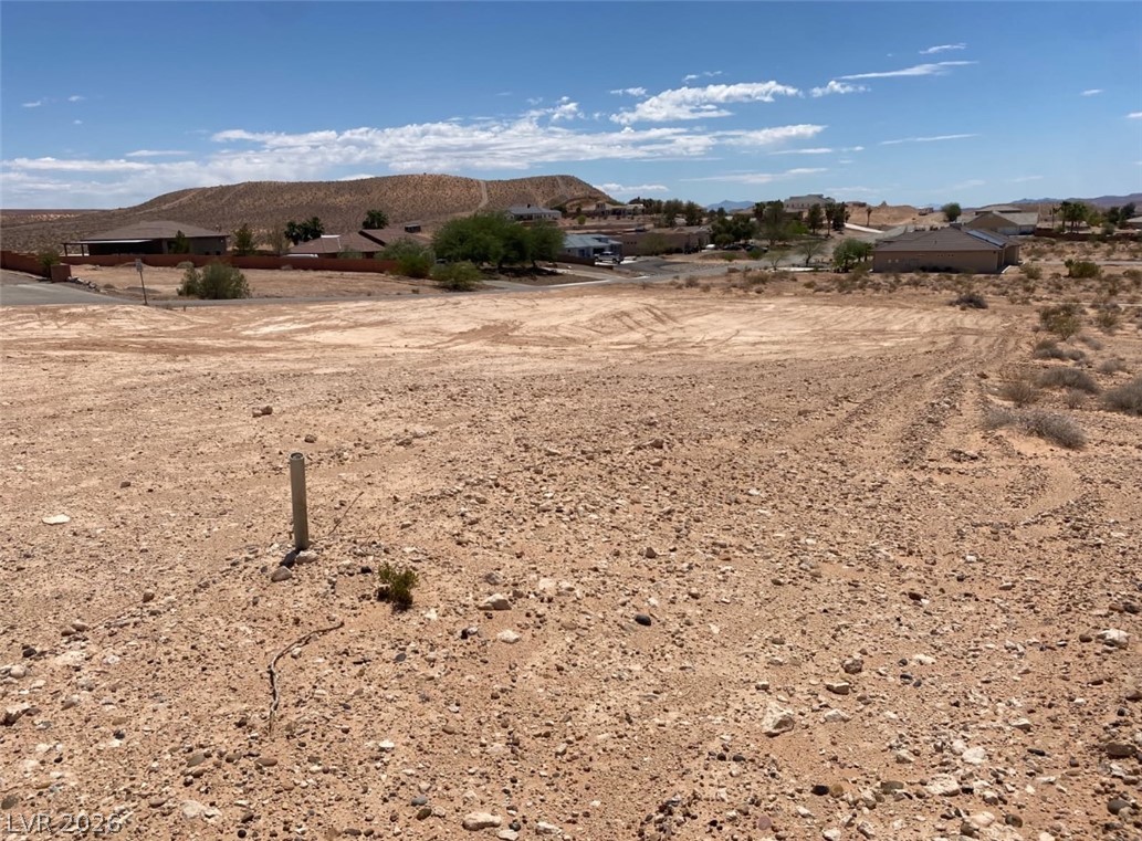 3175 Lou Street Logandale, NV 89021 - Photo 4 of 4 This spacious vacant lot offers sweeping views of the surrounding natural landscape, ready for your vision.