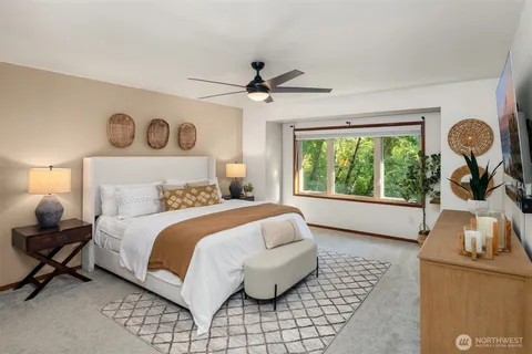 a bedroom with a bed and window