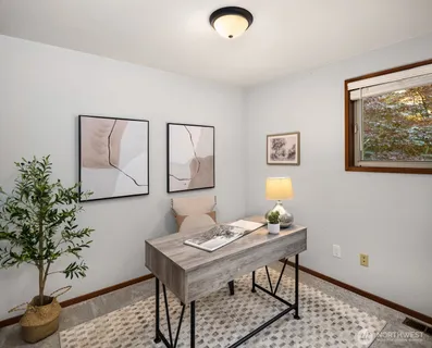 a view of a workspace with furniture