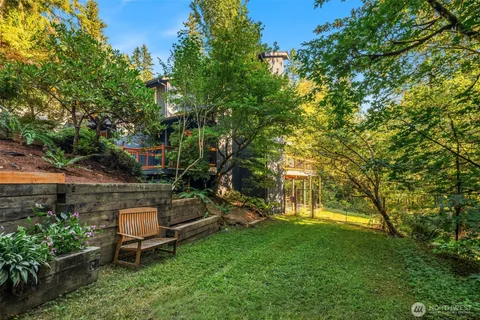 a front view of a house with swimming pool and porch
