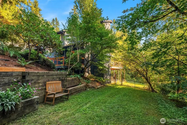 a front view of a house with swimming pool and porch