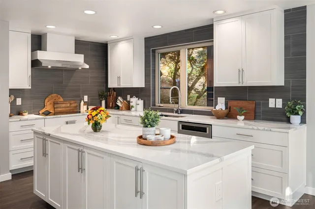 a kitchen with a sink a stove and cabinets