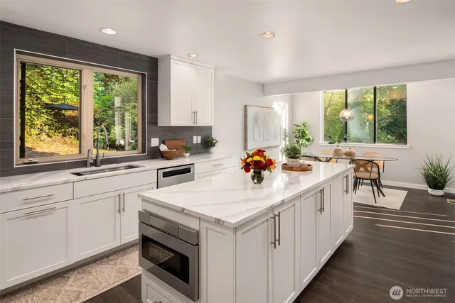 a kitchen with a stove a sink and a refrigerator