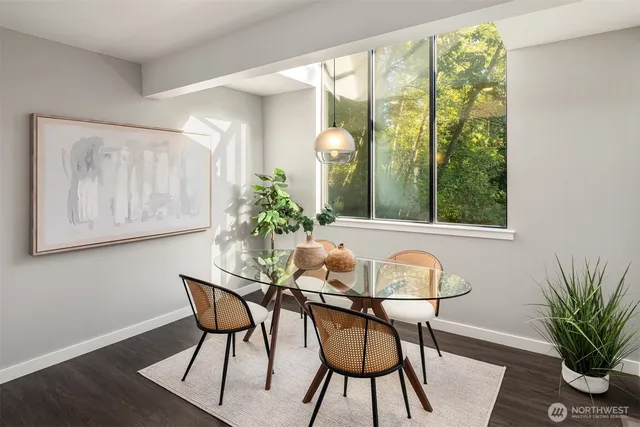 a dining room with furniture and window