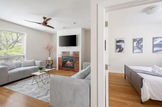 a living room with furniture and a fireplace