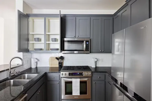 a kitchen with a stove and a microwave