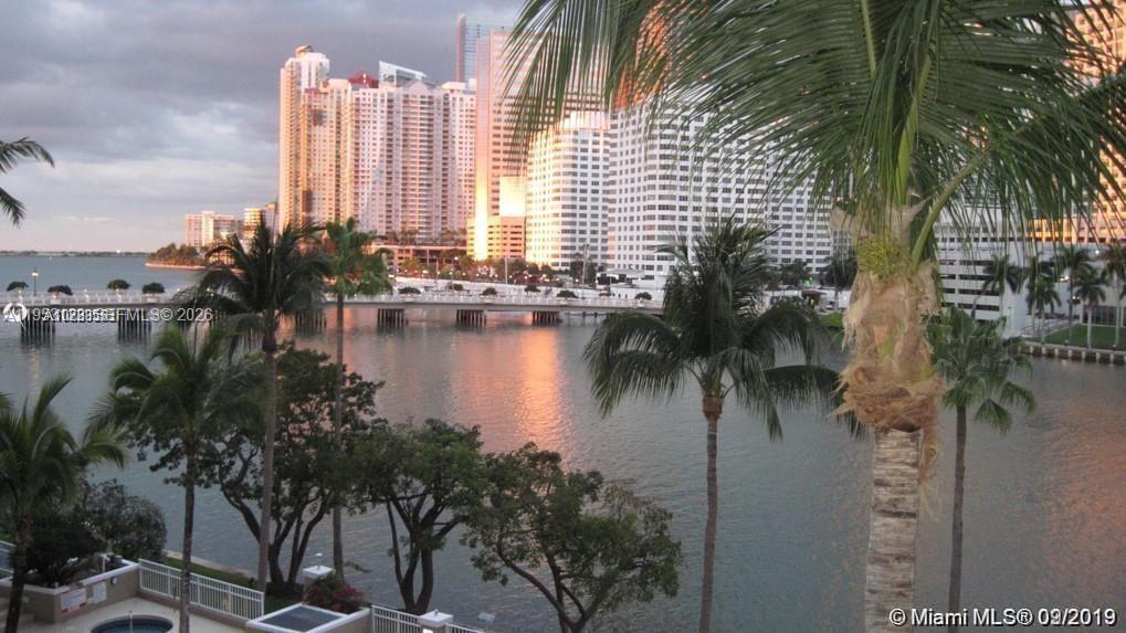 701 Brickell Key Boulevard, Unit 2004 Miami, FL 33131 - Photo 2 of 17 a view of a lake with a building in the background