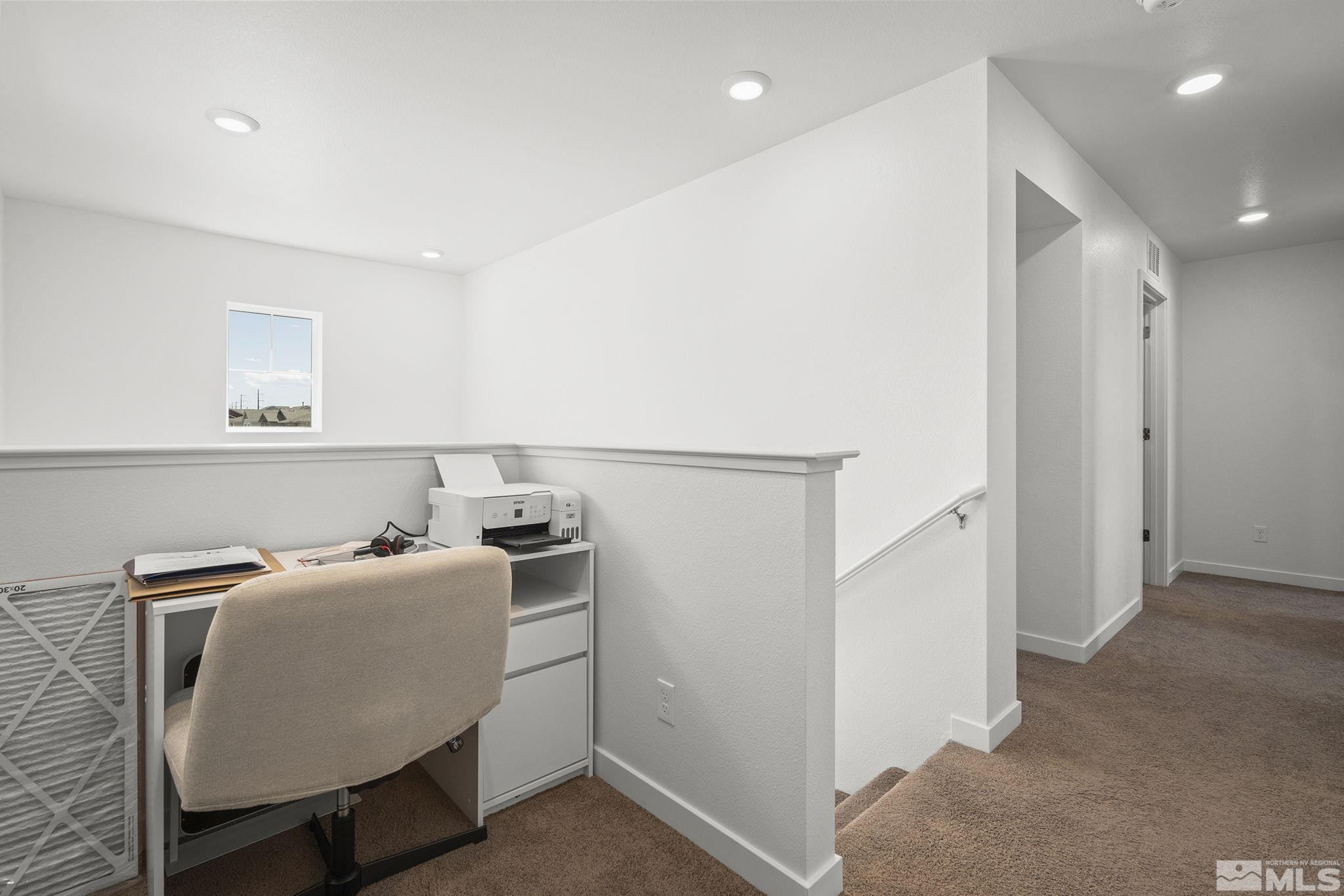 583 Iris Rainbow Drive Reno, NV 89506 - Photo 12 of 22 a living room with a couch and a table