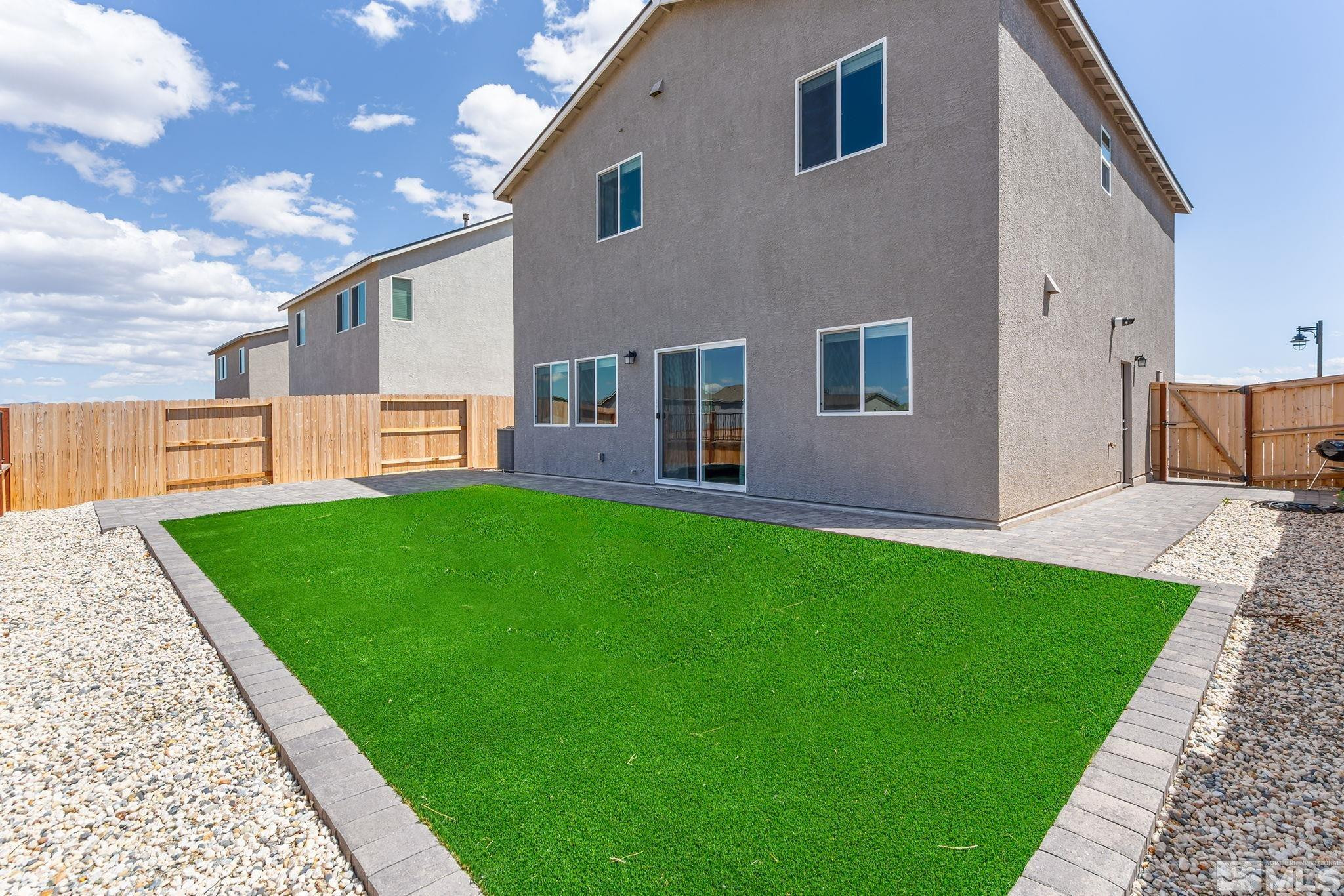583 Iris Rainbow Drive Reno, NV 89506 - Photo 20 of 22 a house view with a garden space
