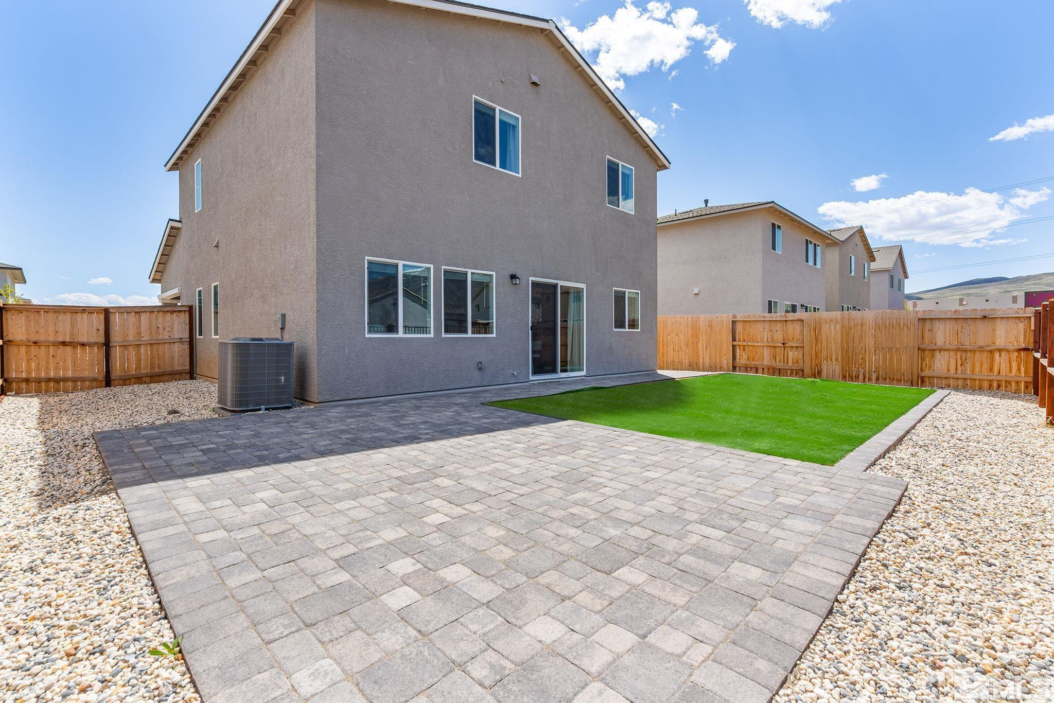 583 Iris Rainbow Drive Reno, NV 89506 - Photo 21 of 22 a view of a house with a yard