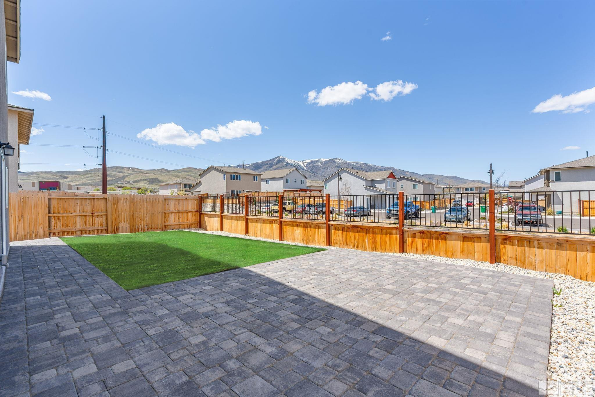 583 Iris Rainbow Drive Reno, NV 89506 - Photo 22 of 22 a view of a swimming pool with an outdoor space and seating area