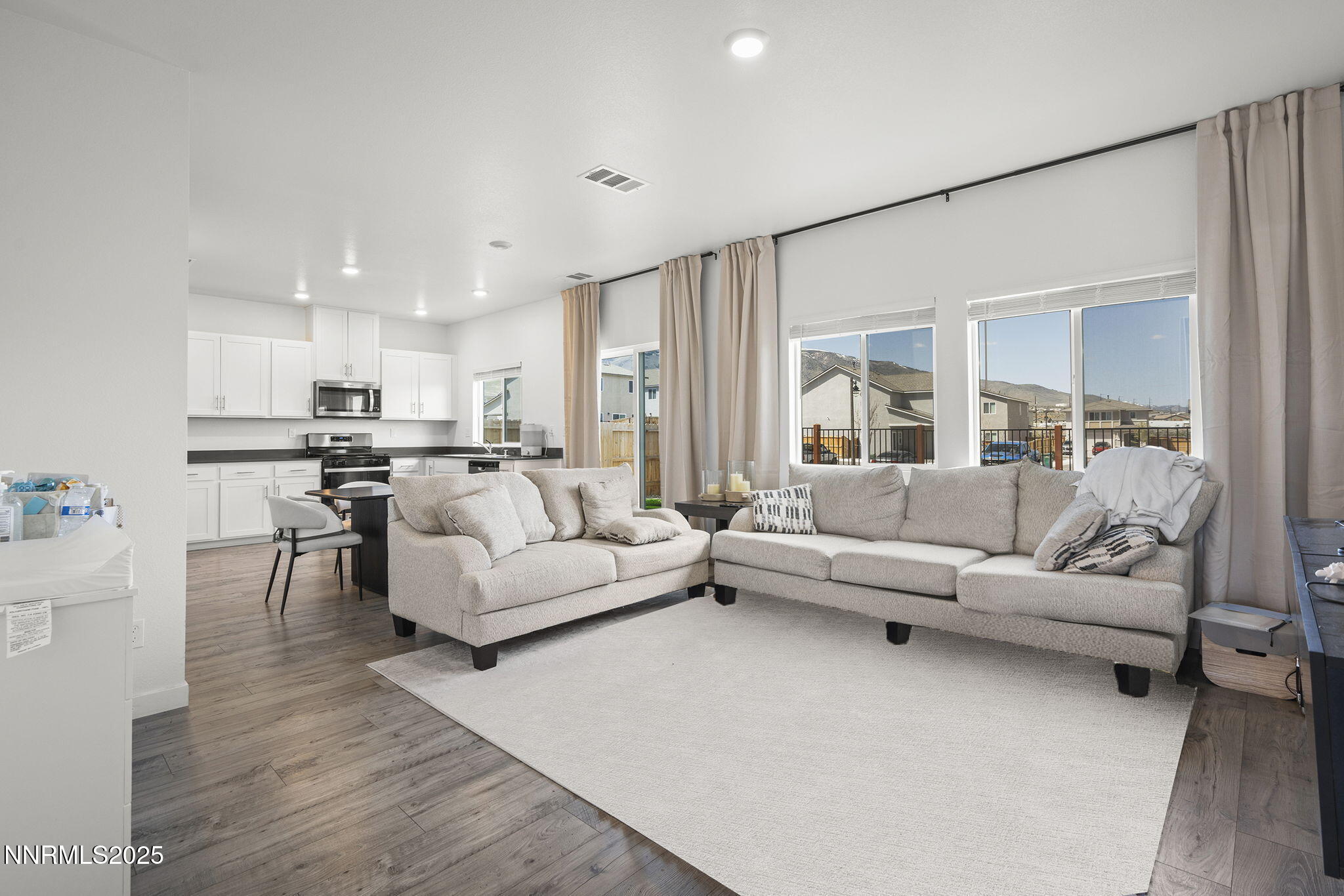 583 Iris Rainbow Drive Reno, NV 89506 - Photo 4 of 22 a living room with furniture and a large window