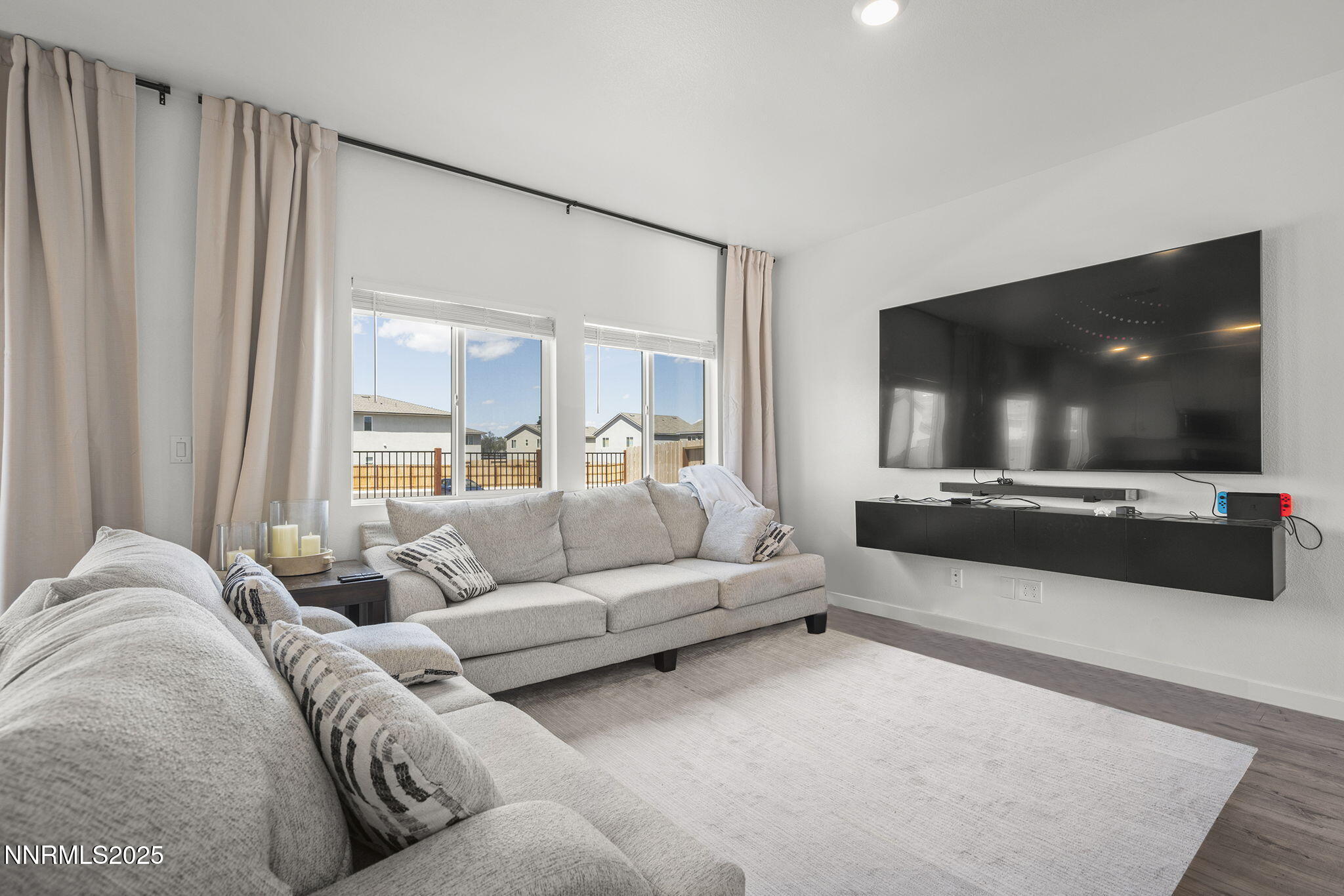 583 Iris Rainbow Drive Reno, NV 89506 - Photo 5 of 22 a living room with furniture and a flat screen tv