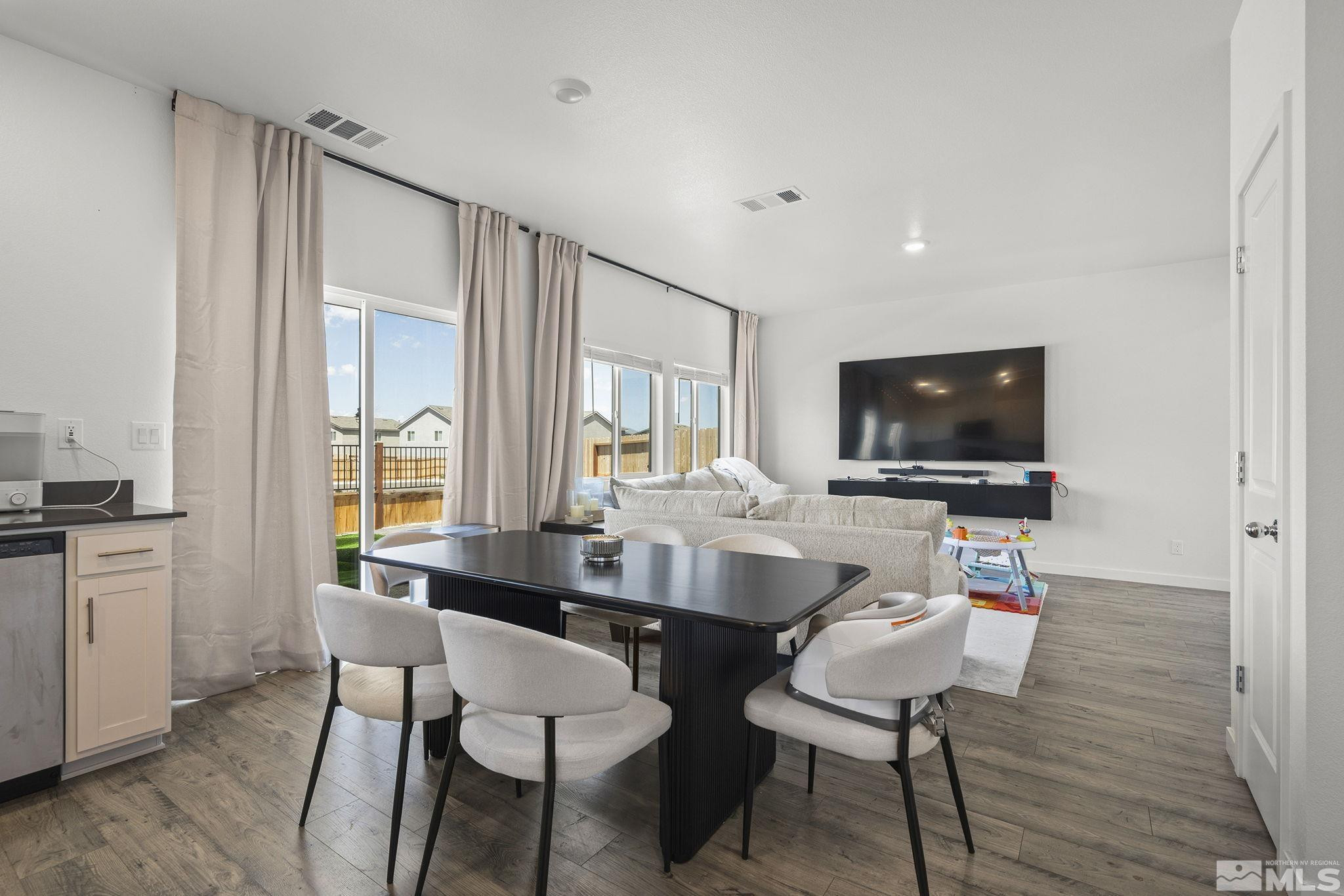 583 Iris Rainbow Drive Reno, NV 89506 - Photo 8 of 22 a dining room with furniture and window