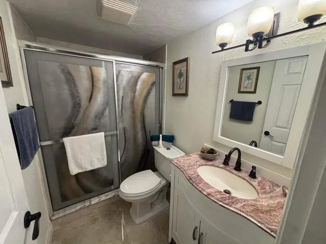 a view of a chairs and table in the balcony