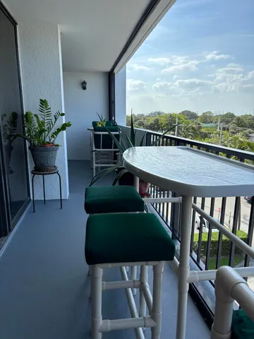 a terrace with outdoor seating and city view