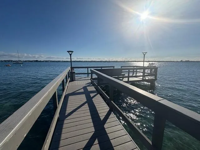 a living room with furniture pool table table and flat screen tv