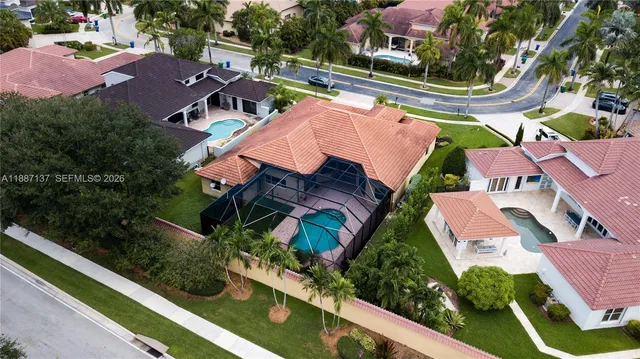 an aerial view of residential houses with outdoor space