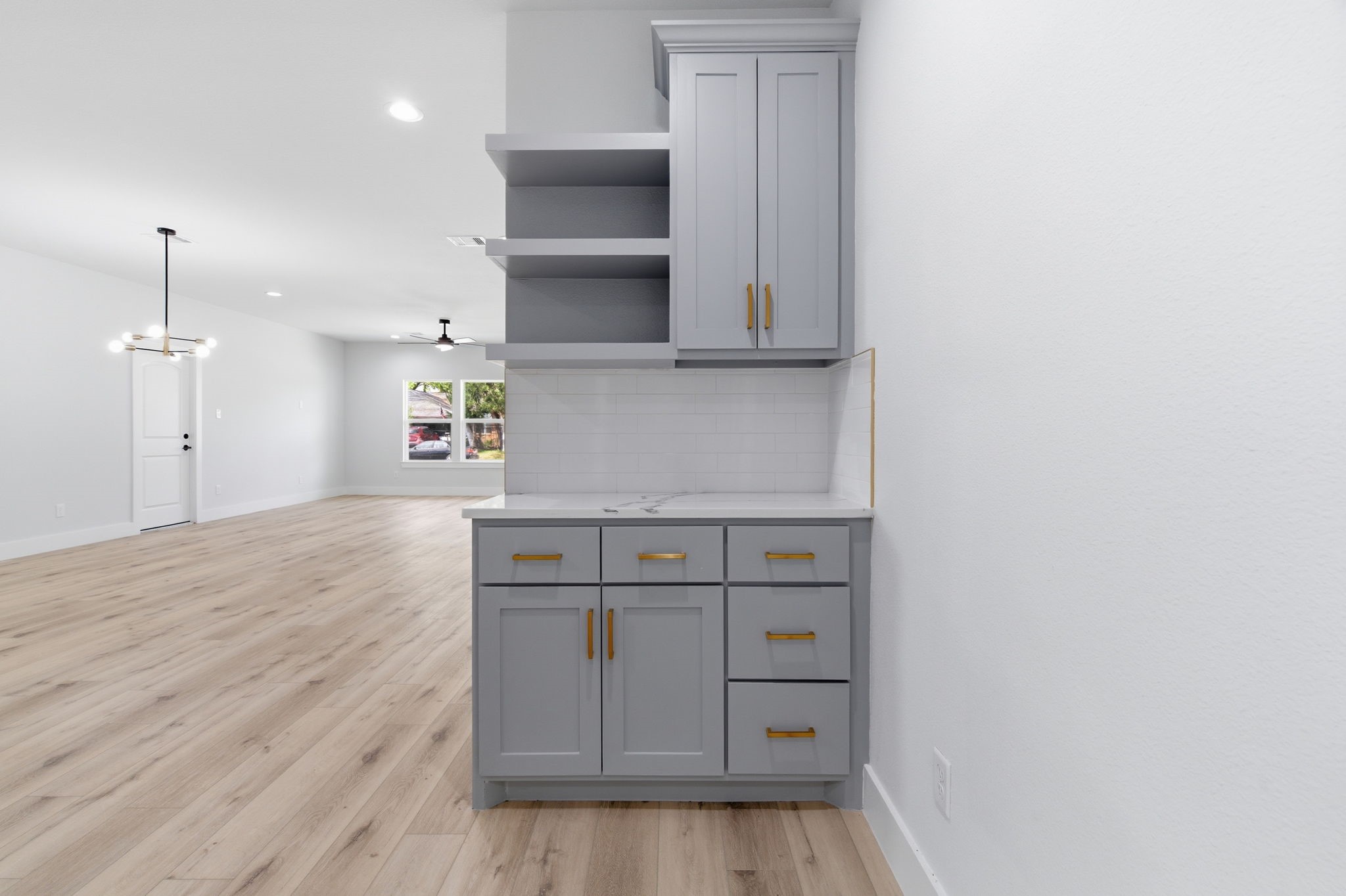 7040 Kinney Street Houston, TX 77087 - Photo 4 of 47 a kitchen with cabinets and wooden floor