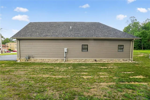 a front view of house with garden