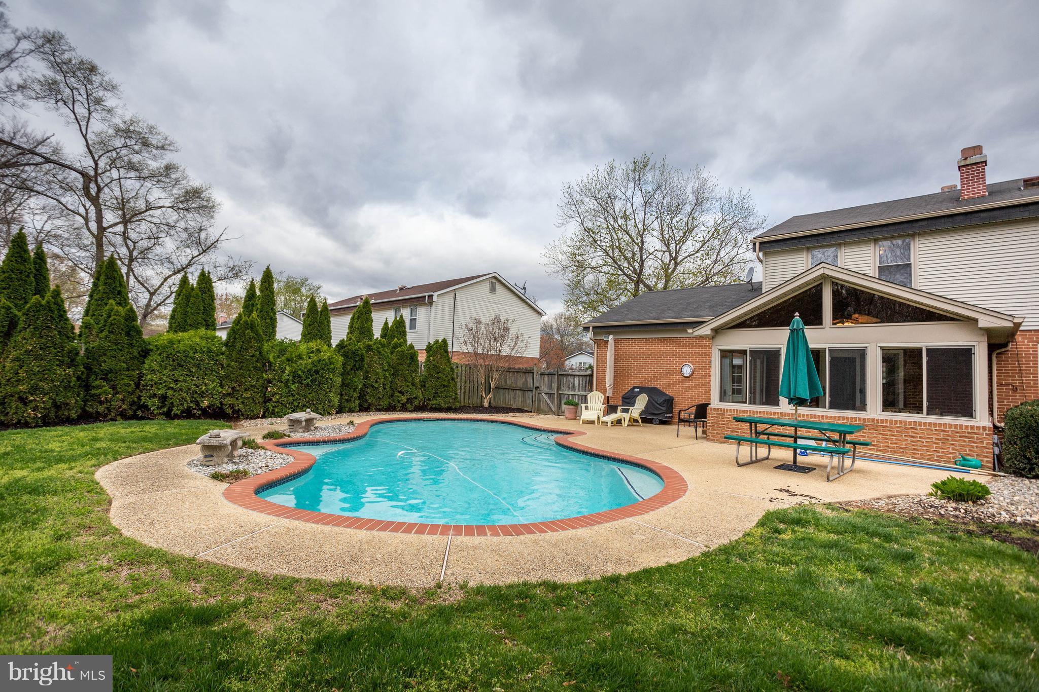 11633 Rivershore Drive Dunkirk, MD 20754 - Photo 15 of 29 a view of a house with swimming pool and a yard