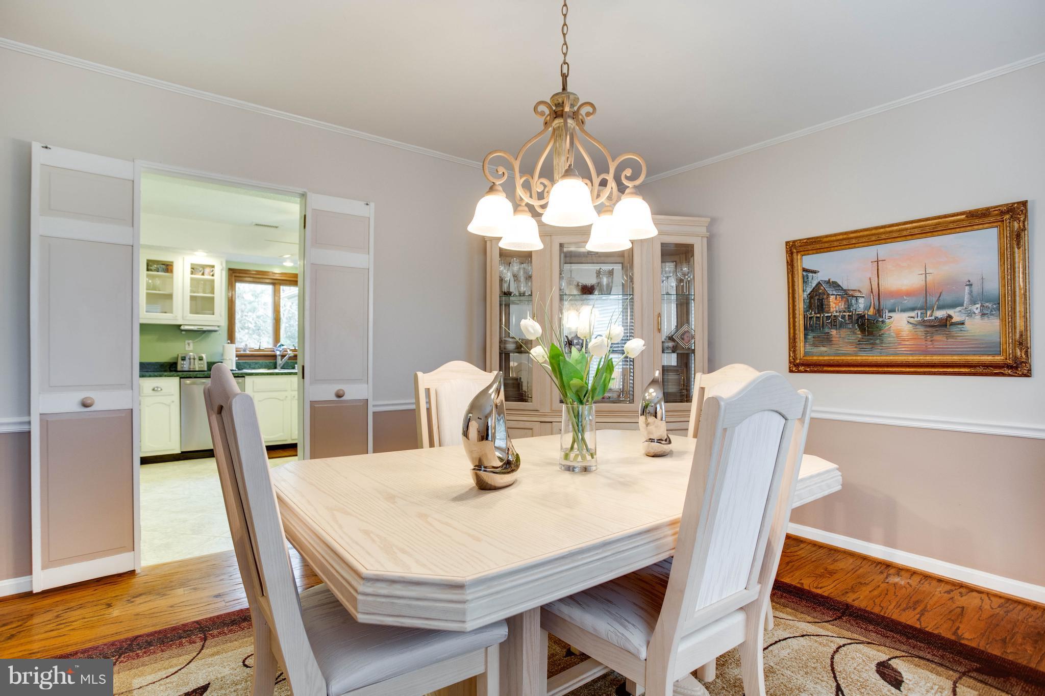 11633 Rivershore Drive Dunkirk, MD 20754 - Photo 17 of 29 a view of a dining room with furniture window and wooden floor